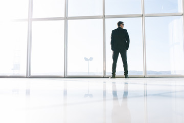 Fototapeta premium Businessman looking at city.