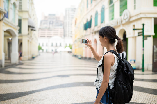 Woman taking photo in Macao