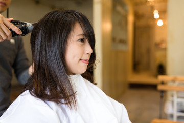 Woman having her hair cut