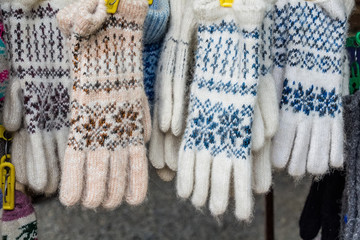 Bunch of handmade colorful woolen gloves