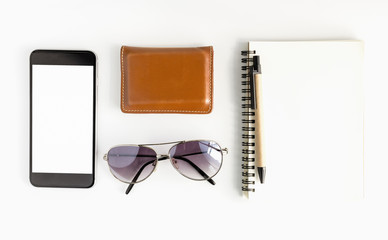 Office workspace with keyboard pen and smartphone on white background.Top view, copy space