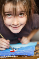 Cute little girl painting