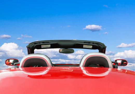 Red Car With Blue Sky Background