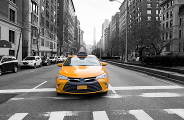 New York City taxi in yellow color in the traffic light