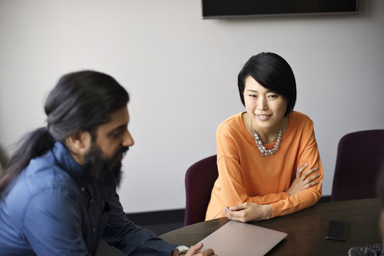 Multi ethnic business colleagues in an office meeting