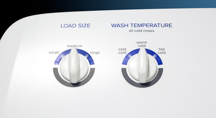 Washing Machine-Load-Temp Knobs - Clothes washer front panel with a focus on the Load Size and Temperature knobs. Straight lighting.