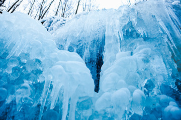 frozen small mountain waterfall close up