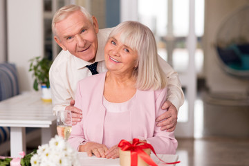 Obraz na płótnie Canvas Magnificent elderly couple modeling for photo
