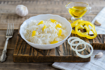 Sauerkraut in a white bowl, traditional russian cuisine