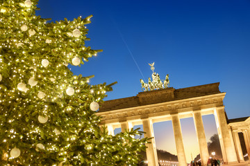 Christmas tree in front of Brandenburg gate in the evening