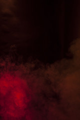 Red smoke in a dark room. Texture, background 