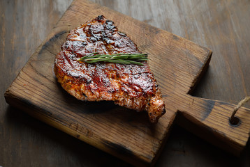 grilled juicy steak with rosemary. 