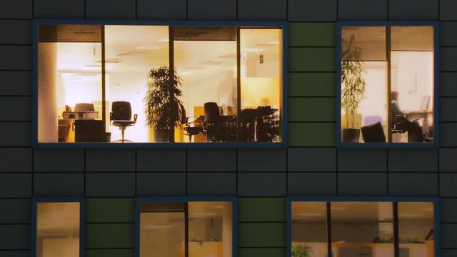 Windows light up in the house. Fragment of the layout of the building