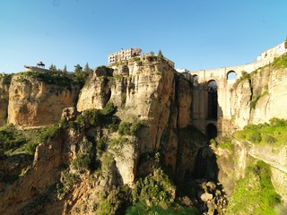 View of the Ronda town and buildings on the rocks in Spain