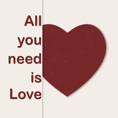 Valentines card with red heart and all you need is love phrase. 