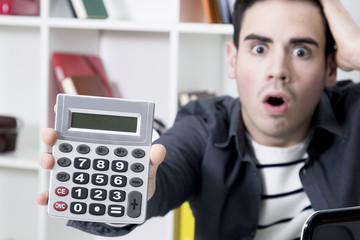 calculator in first plane with man afraid