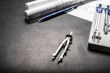 Construction planning drawings on black background