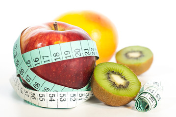 Red apple fitnes concept with centimeter.