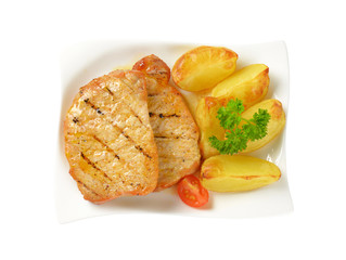 Grilled pork chops with potato wedges