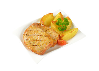 Grilled pork chops with potato wedges