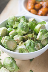 a white bowl of brussells sprouts