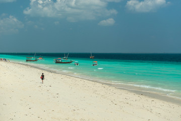 Zanzibar beach and touristic boats in the ocean