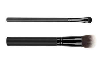 Two cosmetic brushes for applying face makeup blusher and foundation, one Kabuki or mushroom brush and one eye smudge brush, beauty products isolated on white background, clipping path included