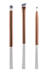 Three professional luxury cosmetic brushes for applying face makeup (eyelid shadow brush, eyebrow brush and eyeliner brush), beauty products isolated on white background, clipping path included