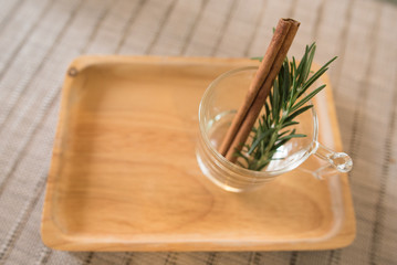 rosemay and cinnamon in glass
