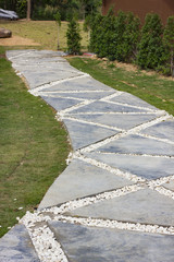 beautiful pathway in green lawn