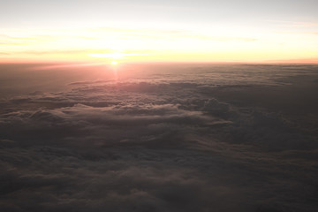 Fototapeta na wymiar Sunset from airplane, Somewhere