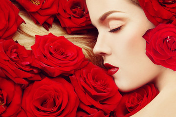 Vintage style profile portrait of young beautiful girl with closed eyes and red roses in her blond hair