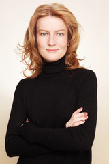 Obraz premium Portrait of beautiful happy smiling mature woman with curly hair and clean make-up