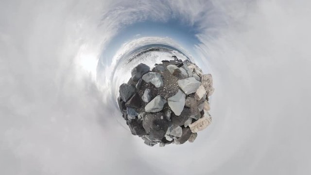 Sea and rocks. Rolling Tiny Little Planet