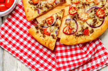 Minced meat tomato red onion pizza