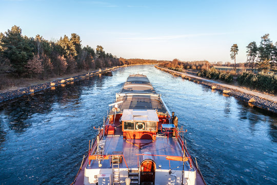 inland vessel drives a canal river along
