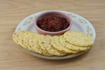 Breakfast appetizer or snack plate of pepper jam and popped corn cakes