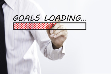 Businessman hand writing goals Loading  with red marker on trans