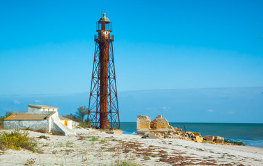 Fototapeta na wymiar Old abandoned lighthouse on the island Dzharylgach