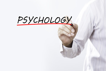 Businessman hand writing PSYCHOLOGY with red marker on transpare