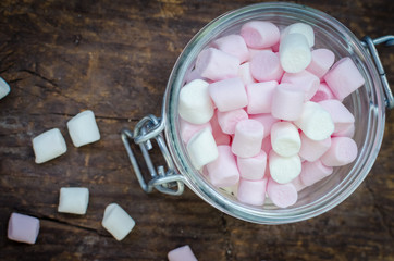 Pink and white marshmallows in a jar