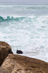 atlantic coastline with surfes in cloudy day