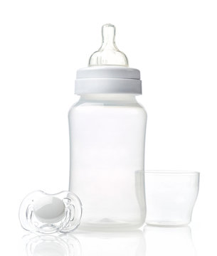 Empty baby bottle and pacifier