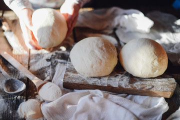 Close up view of baker kneading dough. Homemade bread. Hands pre