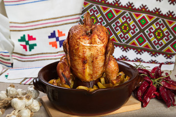 Chicken cooked in the oven on a ceramic base.