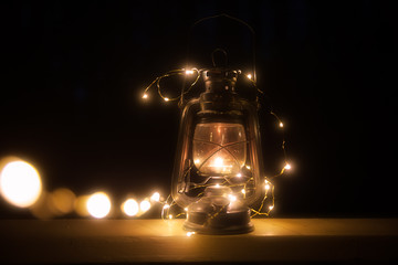 Vintage magic lantern with lights at night