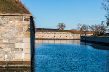 Fortress walls and moat of Fort Monroe National Monument in Hampton Virginia.