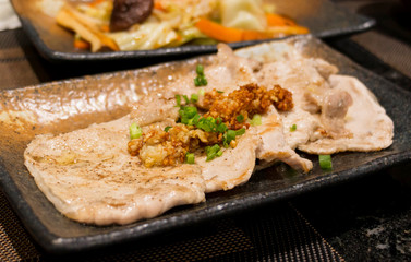 grilled pork on ceramic plate
