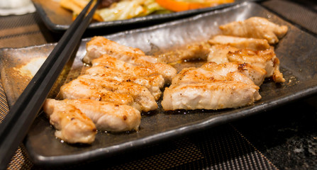 grilled pork on ceramic plate