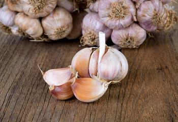 whole garlic on wood table